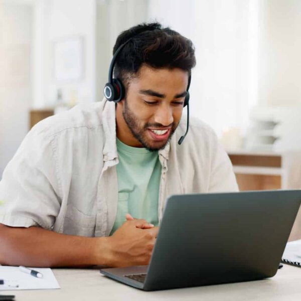 Image of a man working remotely from his home office.
